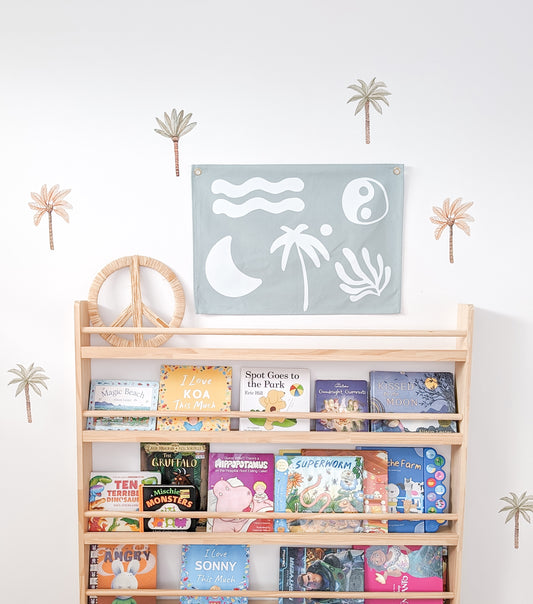 Fun kids wall banner featuring beachy, coastal fun words. Canvas banners feature matching interior design organic cotton sheets and kids bedding | The Cuddle Collective