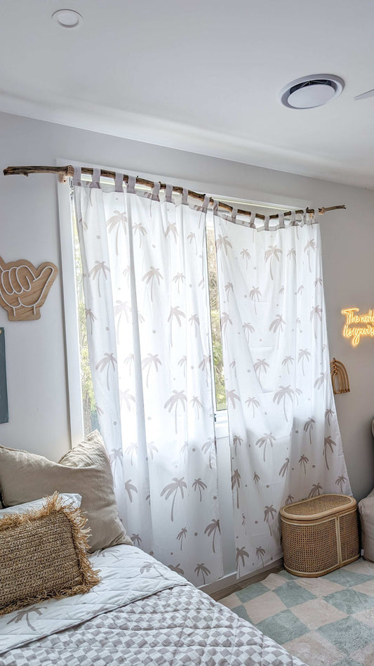 A neutral and coastal kids room featuring kids curtains made of organic cotton completes this cute coastal kids bedding look, an aesthetic kids bedroom, playroom, Montessori room | The Cuddle Collective