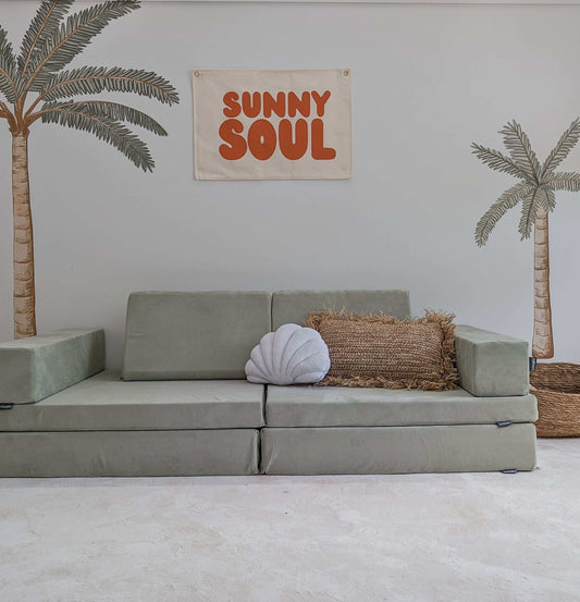 Fun kids wall banner featuring beachy, coastal fun words. Canvas banners feature matching interior design organic cotton sheets and kids bedding | The Cuddle Collective