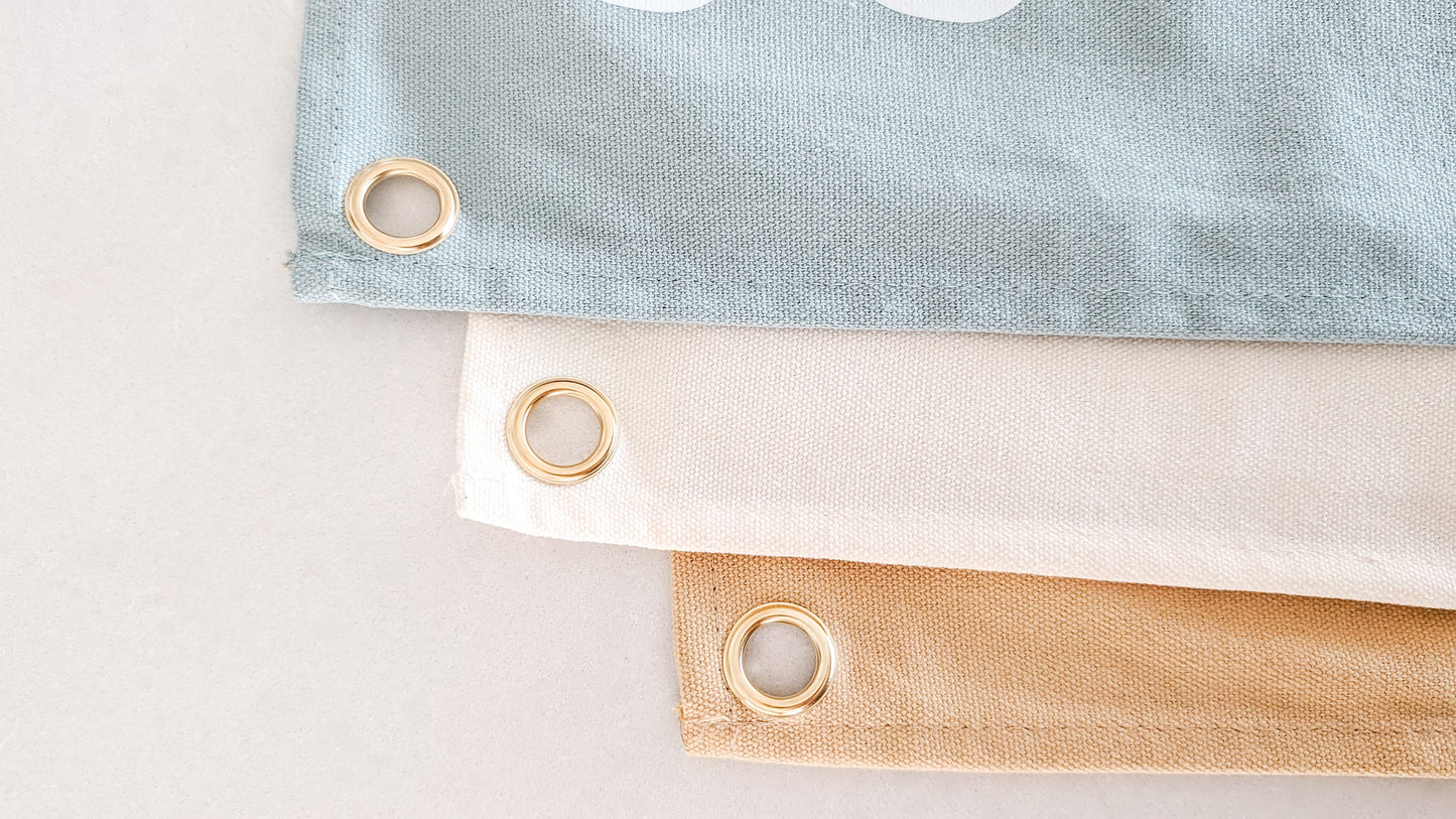 Fun kids wall banner featuring beachy, coastal fun words. Canvas banners feature matching interior design organic cotton sheets and kids bedding | The Cuddle Collective