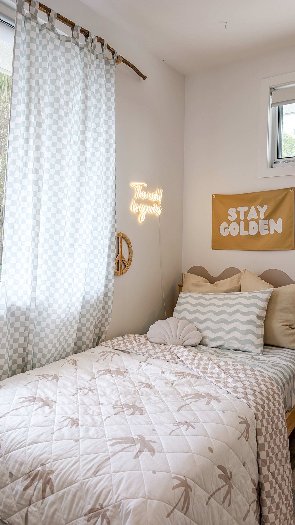 A neutral and coastal kids room featuring kids curtains made of organic cotton completes this cute coastal kids bedding look, an aesthetic kids bedroom, playroom, Montessori room | The Cuddle Collective