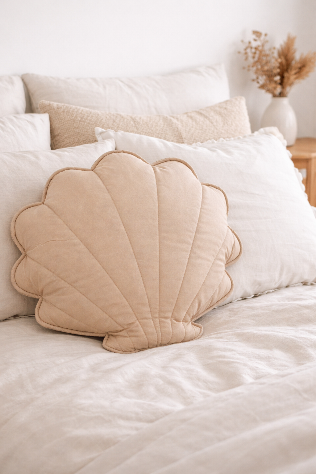 Beige shell cushion coastal bedroom