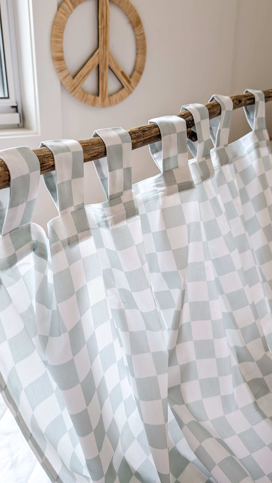 A neutral and coastal kids room featuring kids curtains made of organic cotton completes this cute coastal kids bedding look, an aesthetic kids bedroom, playroom, Montessori room | The Cuddle Collective