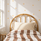 Fabric Wall Decal and fabric wall sticker in the shape of a butter yellow star. It is a high quality fabric wall sticker that won't damage walls.