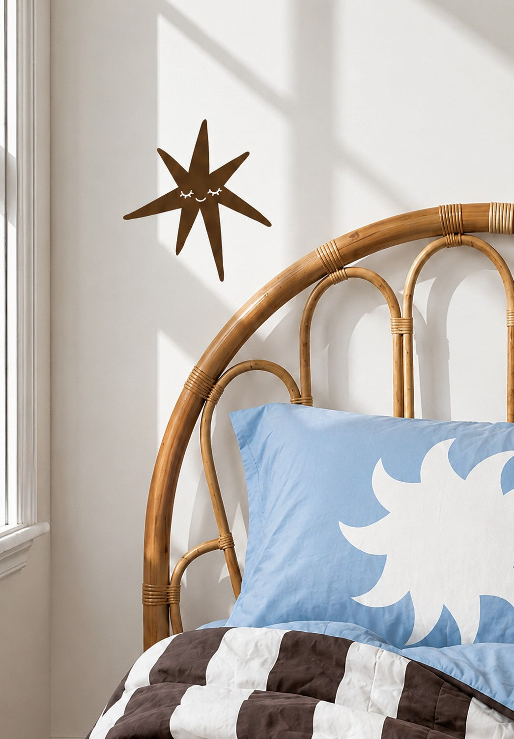 Fabric Wall Decal and wall sticker in the shape of a star with a face on it. It is a high quality fabric wall sticker that won't damage walls.