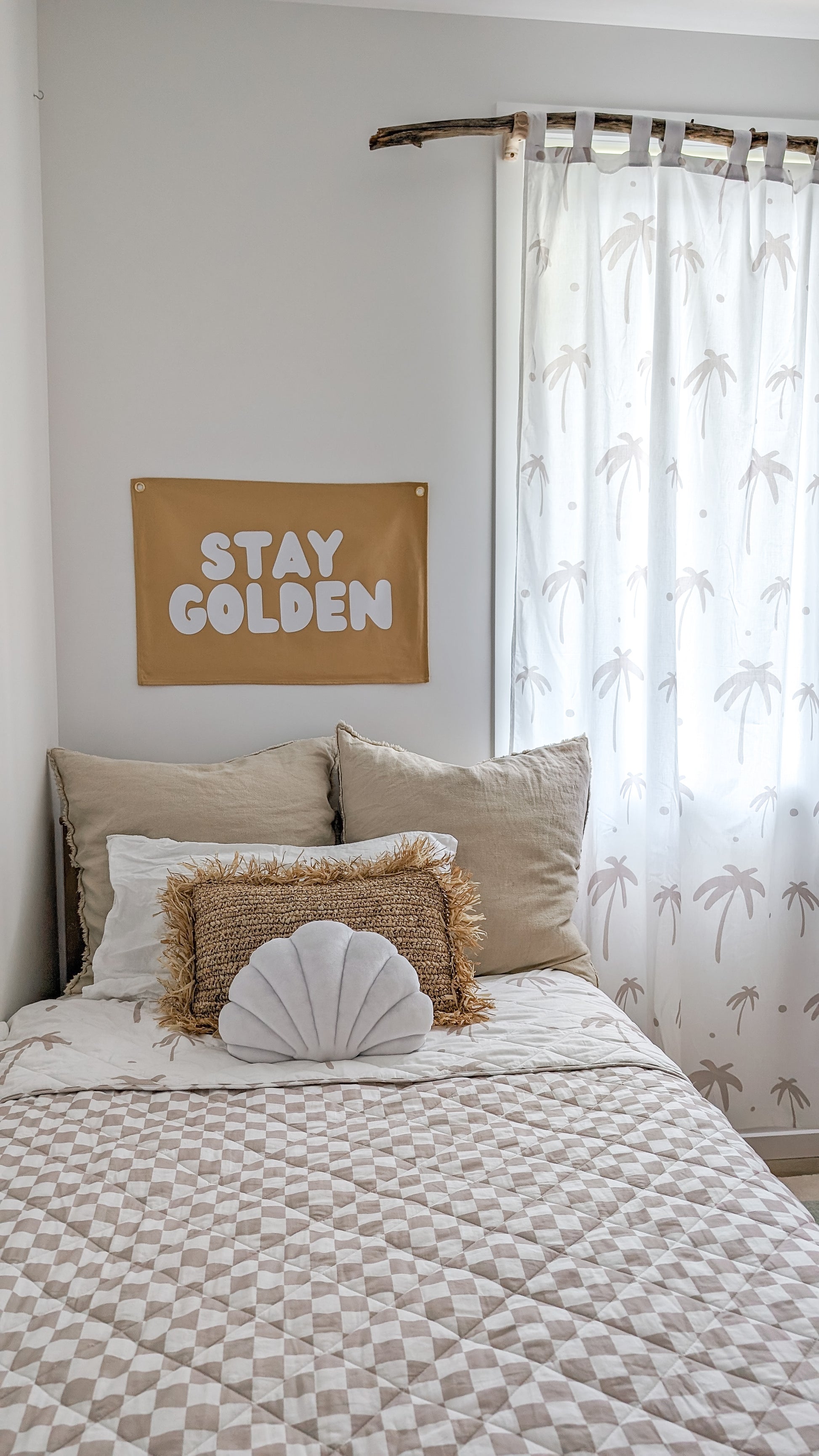A neutral and coastal kids room featuring kids curtains made of organic cotton completes this cute coastal kids bedding look, an aesthetic kids bedroom, playroom, Montessori room | The Cuddle Collective