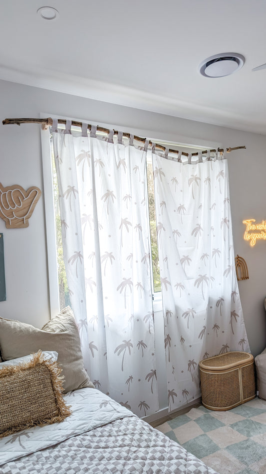 A neutral and coastal kids room featuring kids curtains made of organic cotton completes this cute coastal kids bedding look, an aesthetic kids bedroom, playroom, Montessori room | The Cuddle Collective