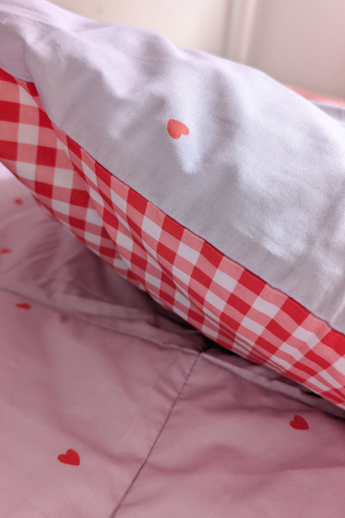 girls bedroom reversible organic cotton pillowcase with red gingham and hearts
