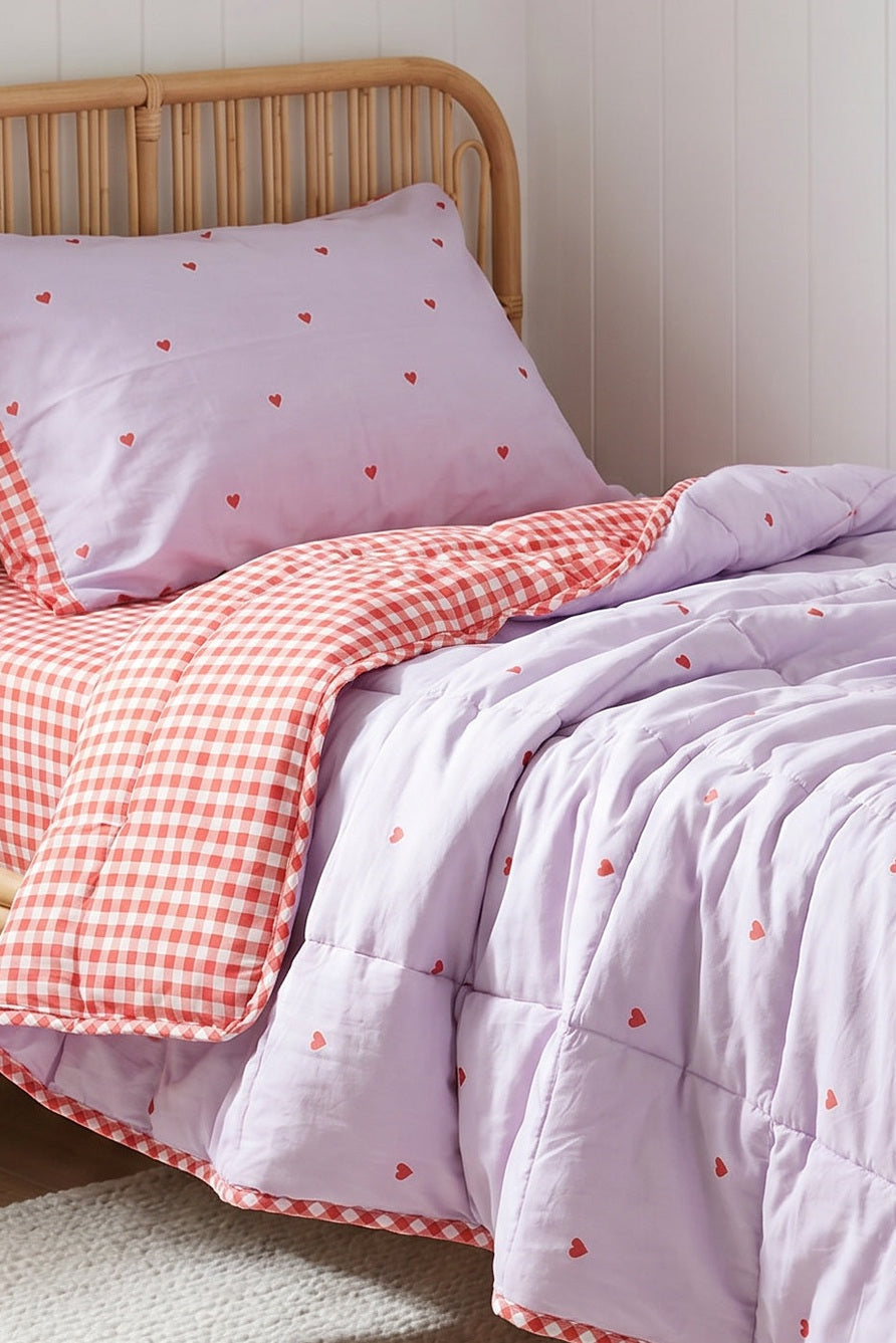 A red gingham and lavender reversible quilt for girls 