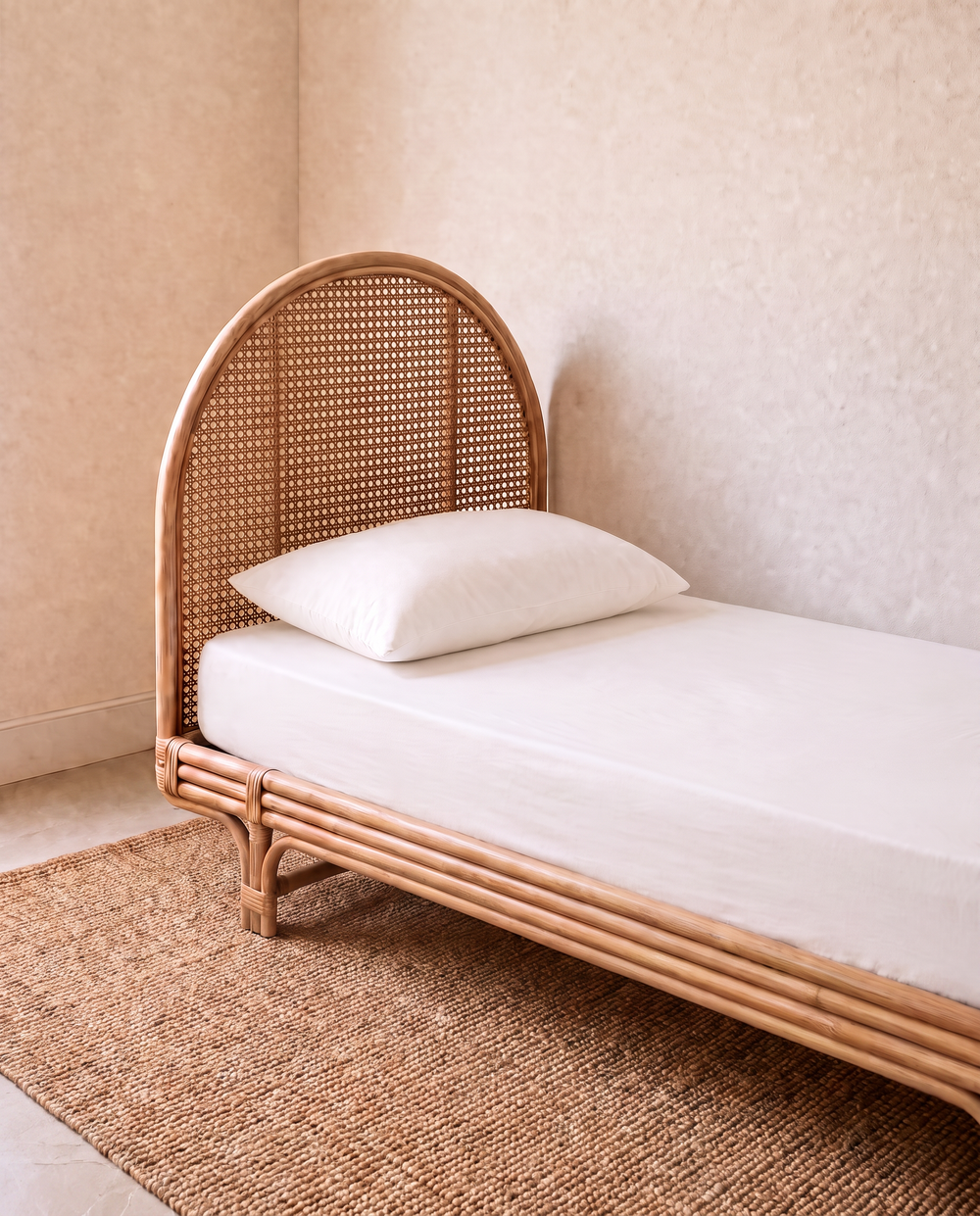 a white sheet set on a single bed