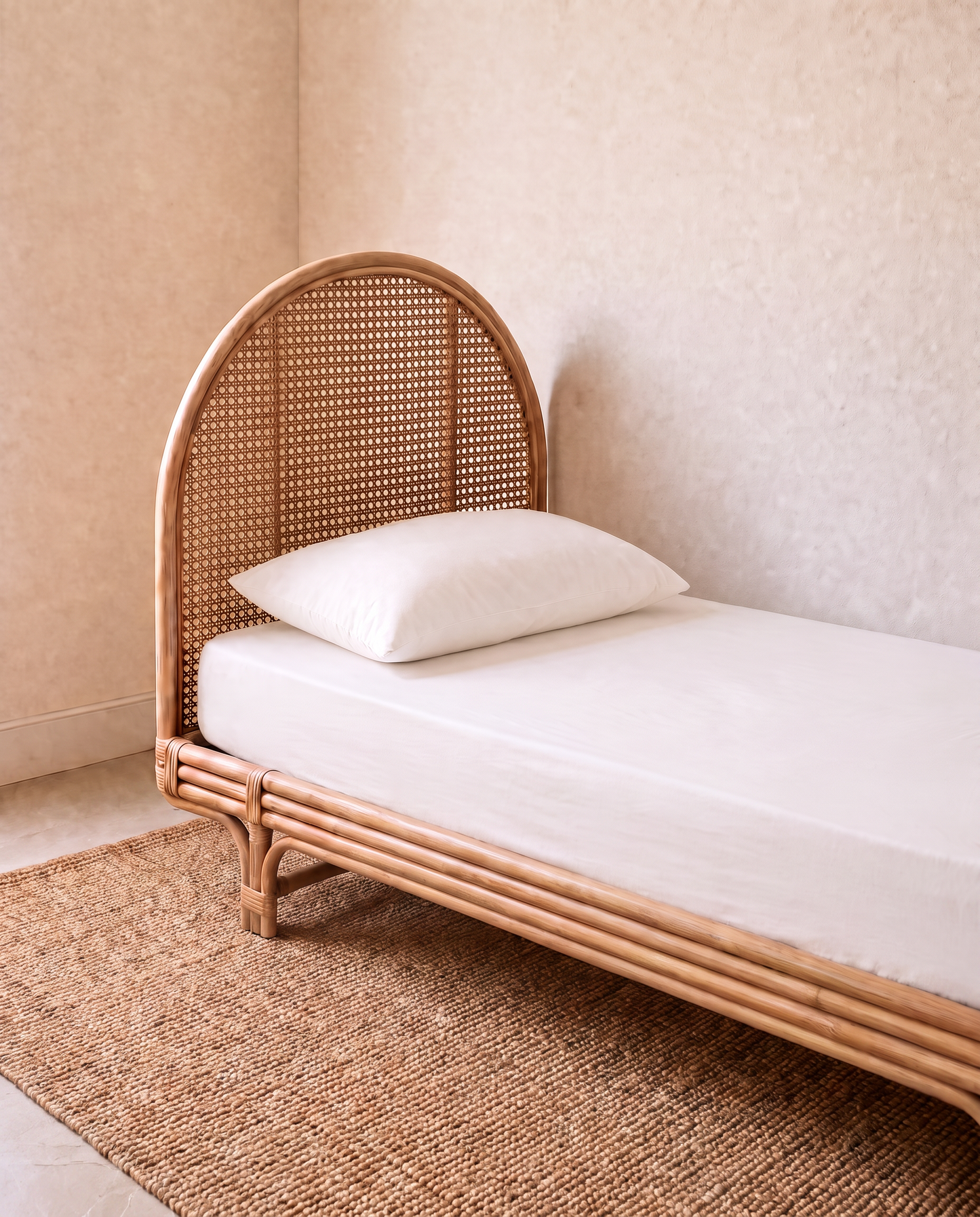 a white sheet set on a single bed