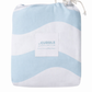 Light blue and white organic cotton fitted sheet with a shell with 'Cuddle Collective' label on a white background