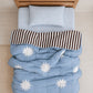A blue star and chocolate stripe reversible quilt and blue gingham kids organic cotton bedding collection