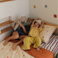 The starfall and coco stripe organic cotton bedding on a kids single bed