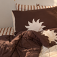 double sided kids pillowcase in chocolate and vanilla with a white sun