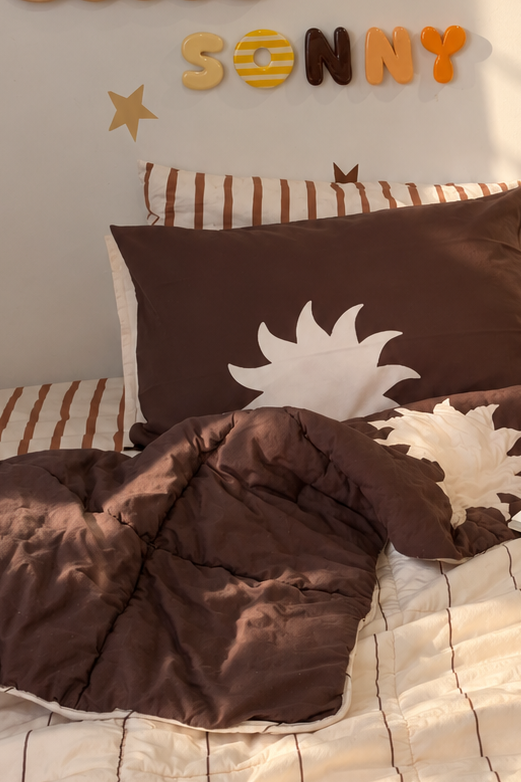 double sided kids pillowcase in chocolate and vanilla with a white sun