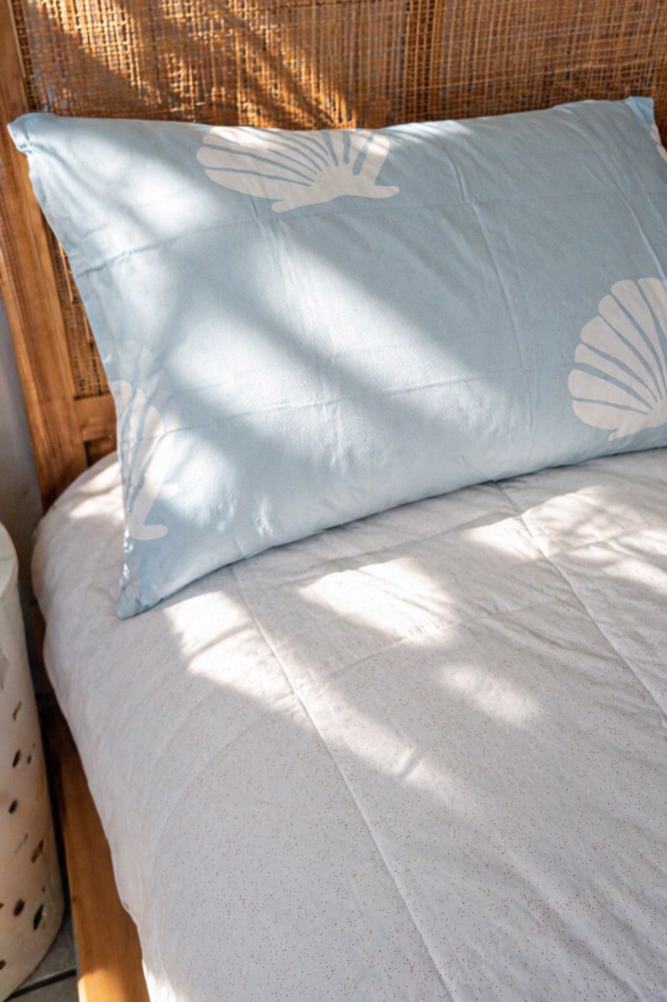 Kids bed styled with Baby Blue Shell organic cotton sheets in soft blue tones