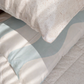Baby blue waves and speckle pillowcases paired as a kids bedding set