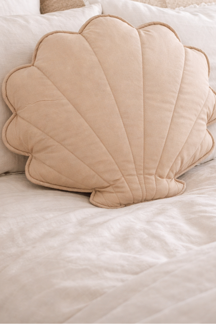 Beige shell cushion coastal bedroom