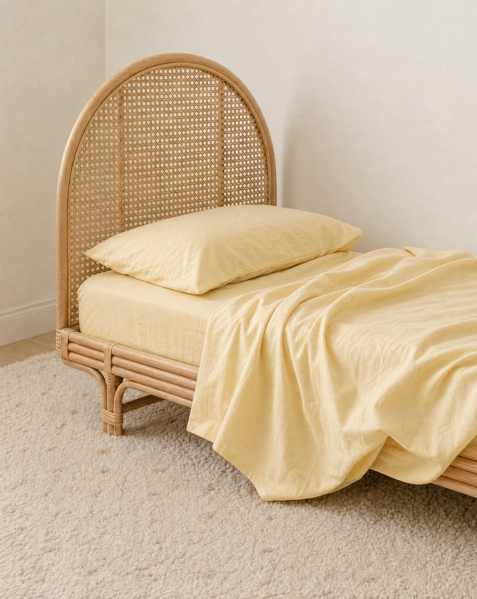 butter yellow organic cotton king single sheet styled on a single bed