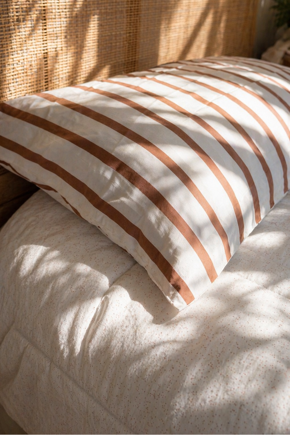 Close-up of Coco Stripe organic cotton fabric with soft woven stripes