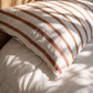 Close-up of Coco Stripe organic cotton fabric with soft woven stripes