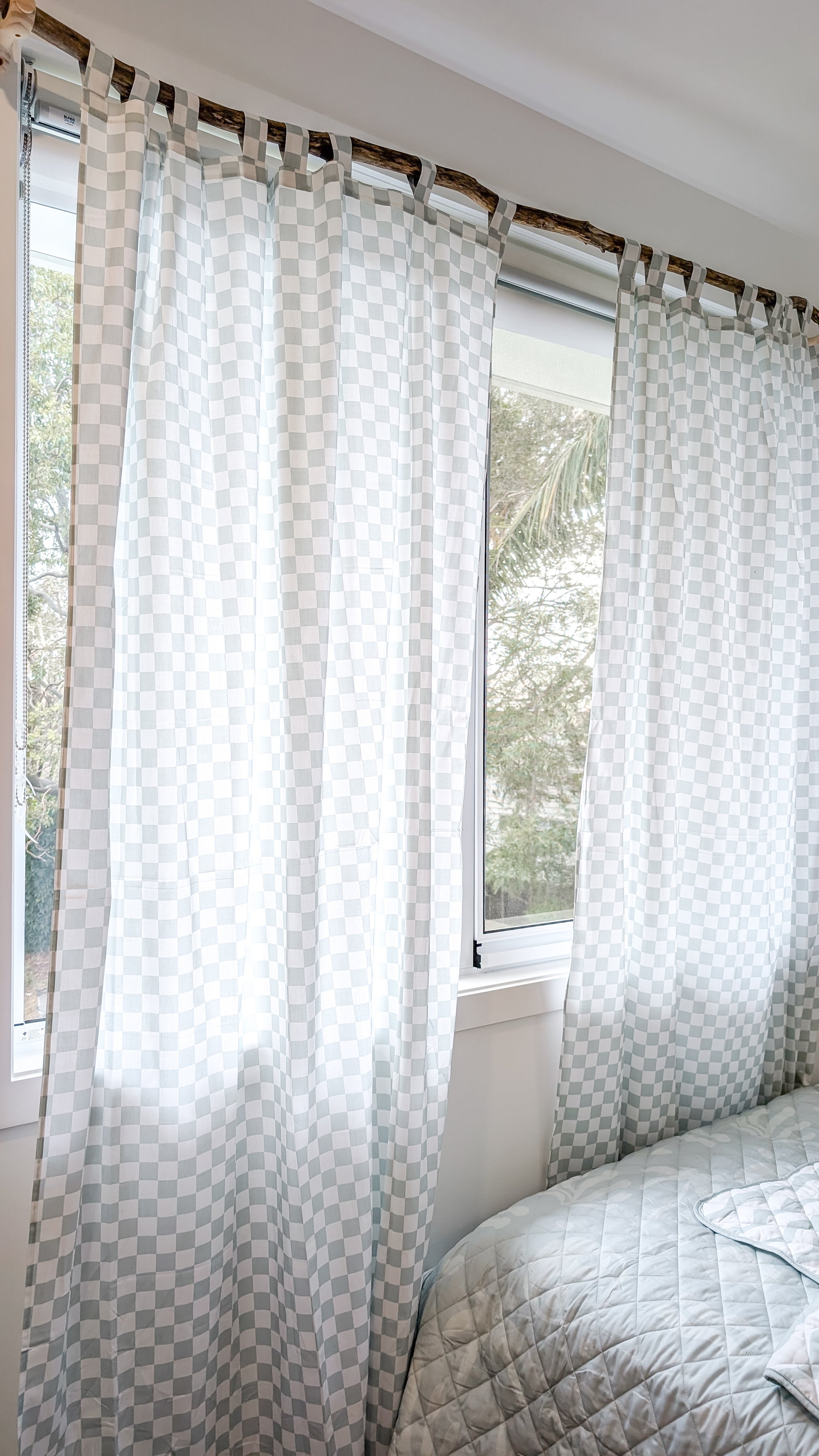 A neutral and coastal kids room featuring kids curtains made of organic cotton completes this cute coastal kids bedding look, an aesthetic kids bedroom, playroom, Montessori room | The Cuddle Collective