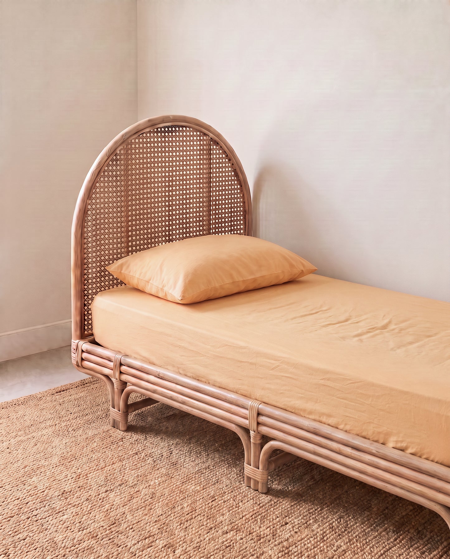 a light yellow orange organic cotton fitted sheet by the cuddle collective
