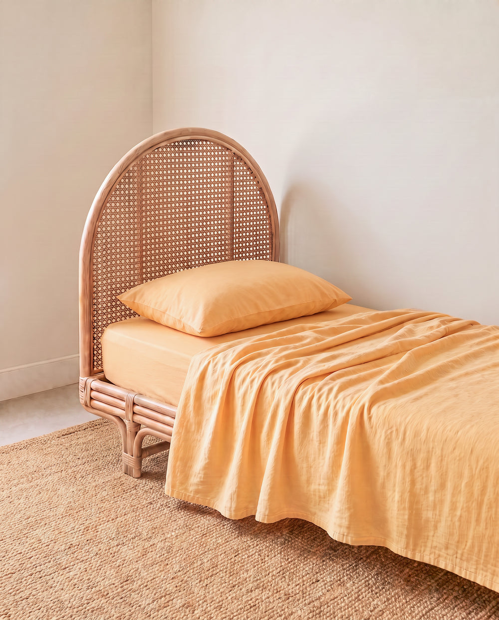 a light yellow orange organic cotton flat sheet by the cuddle collective