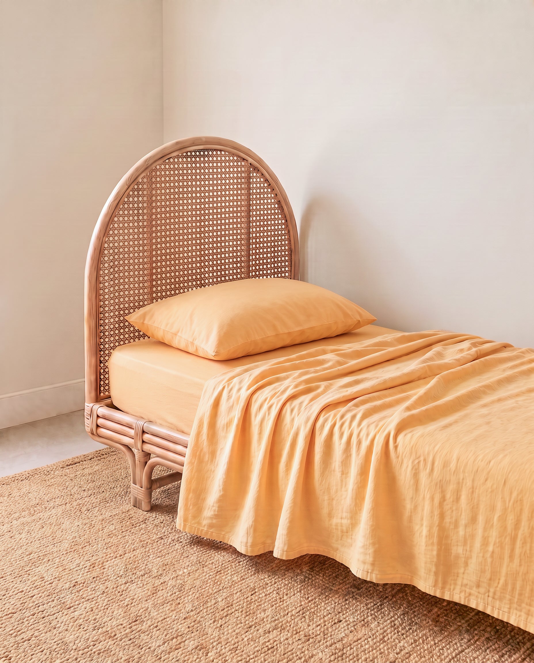 a light yellow orange organic cotton flat sheet by the cuddle collective