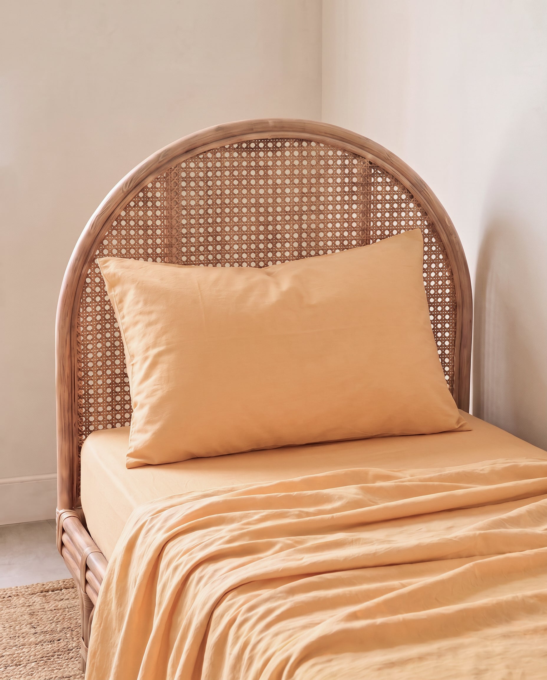a light yellow orange organic cotton pillowcase by the cuddle collective