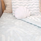 A neutral and coastal kids bed made with organic cotton sheets and organic cotton reversible quilt blanket with wavy stripe print completes this cute coastal kids bedding linen look | The Cuddle Collective