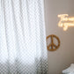 A neutral and coastal kids room featuring kids curtains made of organic cotton completes this cute coastal kids bedding look, an aesthetic kids bedroom, playroom, Montessori room | The Cuddle Collective