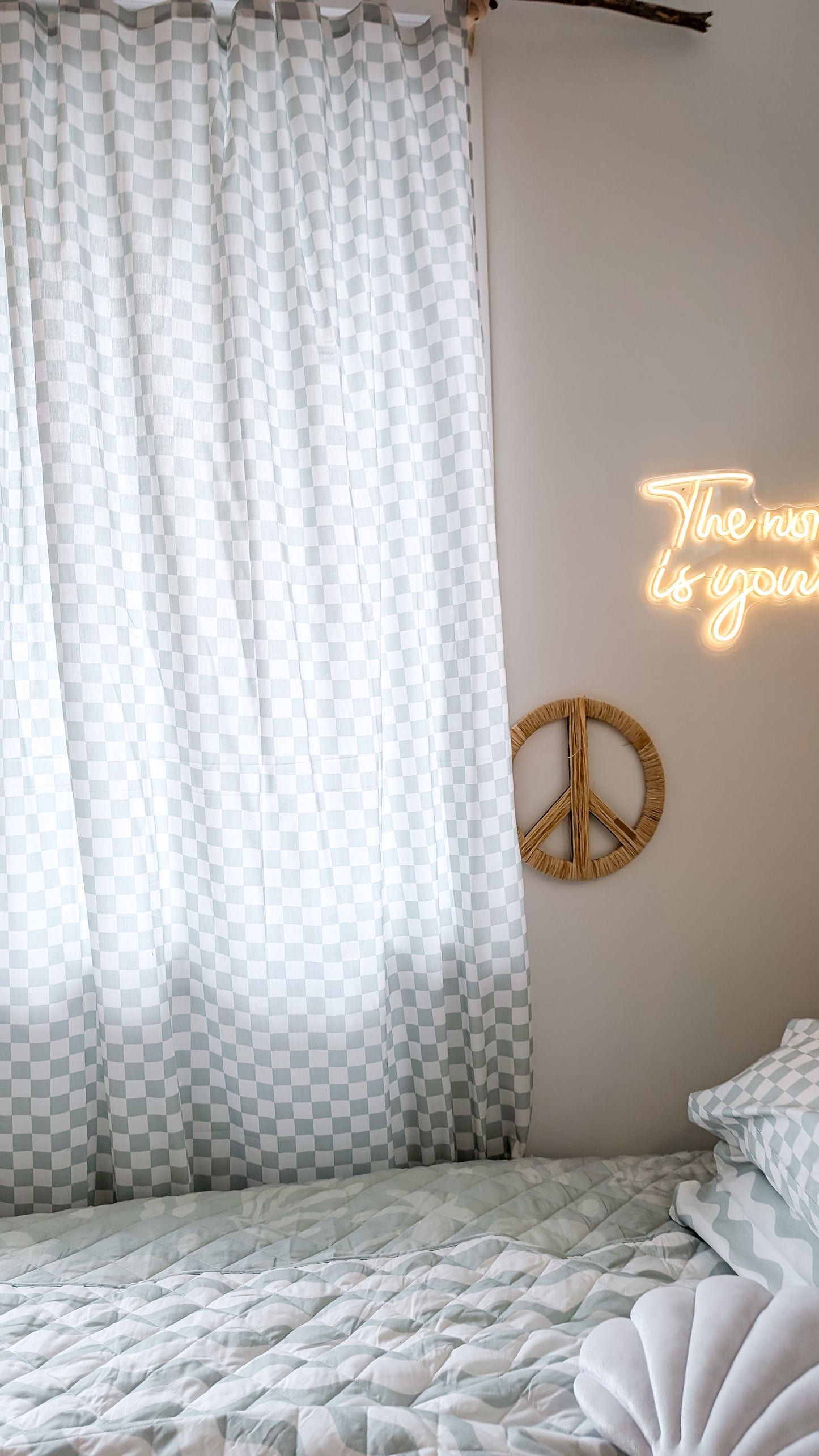 A neutral and coastal kids room featuring kids curtains made of organic cotton completes this cute coastal kids bedding look, an aesthetic kids bedroom, playroom, Montessori room | The Cuddle Collective
