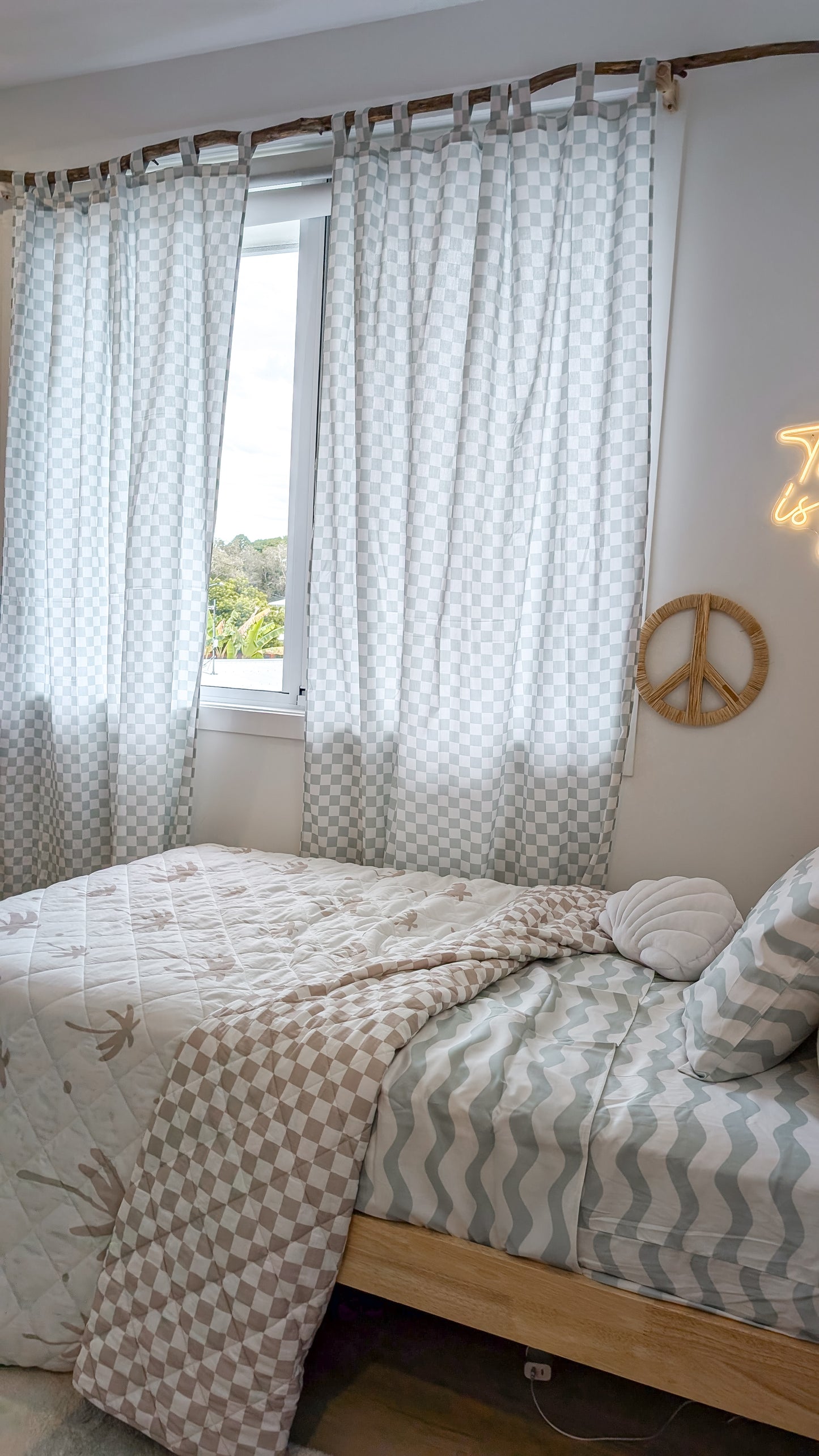 A neutral and coastal kids room featuring kids curtains made of organic cotton completes this cute coastal kids bedding look, an aesthetic kids bedroom, playroom, Montessori room | The Cuddle Collective