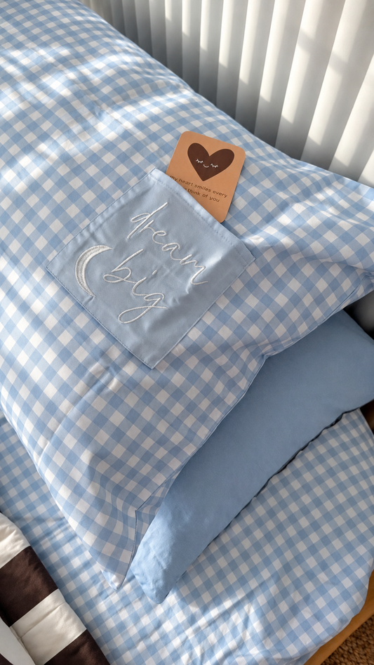 blue gingham organic cotton kids pillowcase with pocket feature