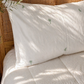 Sage Palm organic cotton sheets with soft green palm print