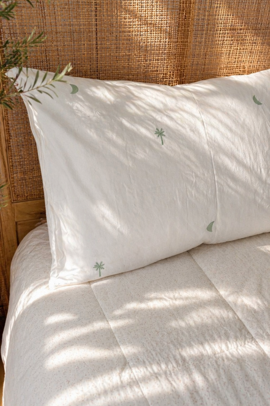 Sage Palm organic cotton sheets with soft green palm print