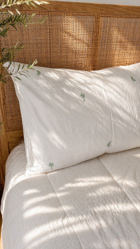 Sage Palm organic cotton sheets with soft green palm print