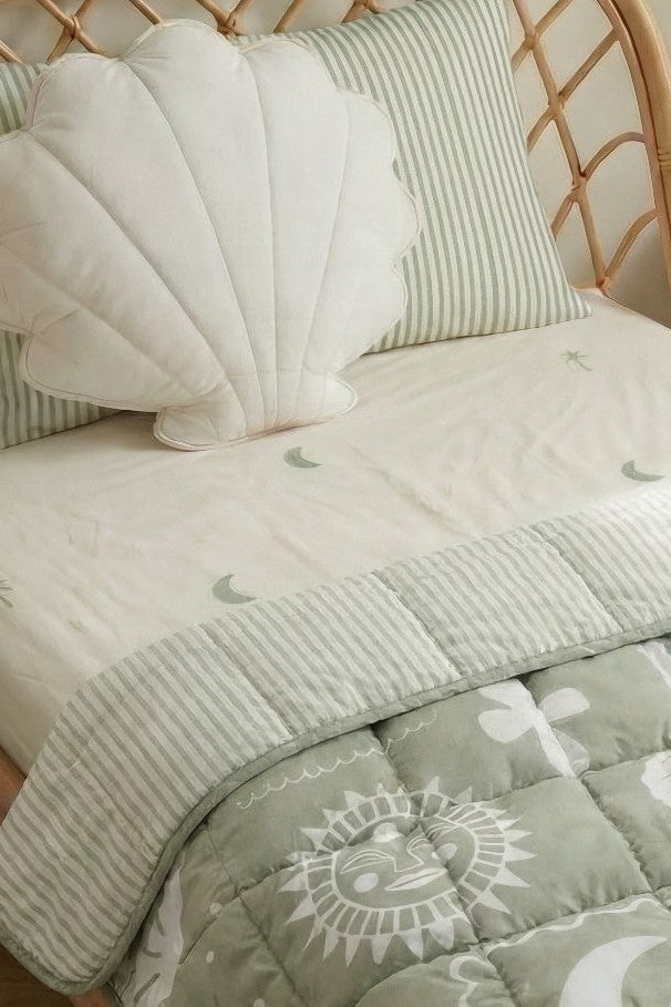 Sage Palm organic cotton sheets with soft green palm print and beachy theme styled in a cute modern kids bedroom