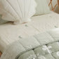 Sage Palm organic cotton sheets with soft green palm print and beachy theme styled in a cute modern kids bedroom