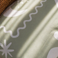 sage kids bedding with a beachy theme