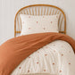 a teracotta and star print quilt cover made with organic cotton, for the cuddle collective. a beautiful kids bedding set