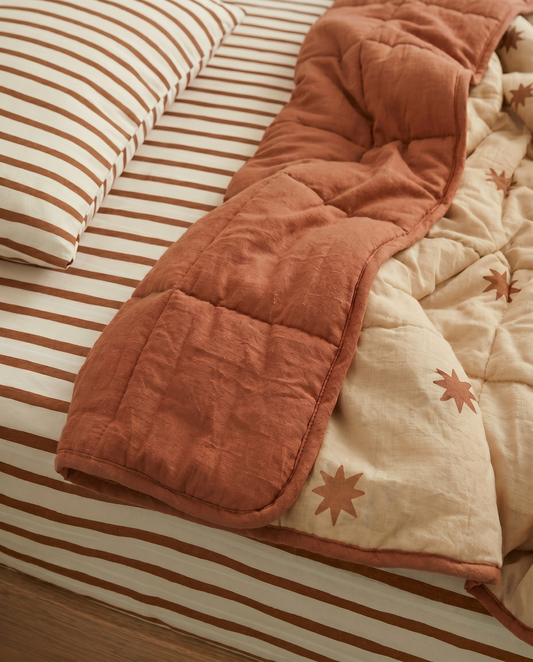 starfall reversible quilt and coco stripe sheet set paired together organic cotton bedding for kids
